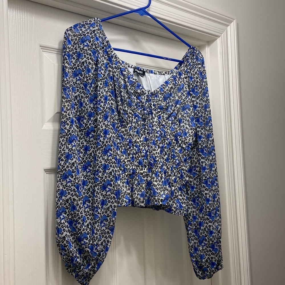 Size small Express long sleeve cropped blouse. Black and blue floral. Stretchy.